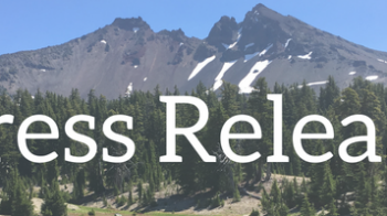 Press Release banner image over mountain landscape